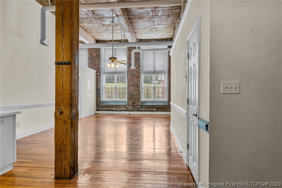 100 Carolyns Mill Place Rockingham, NC 28379 - Photo 24 of 30 a view of a hallway with wooden floor and staircase