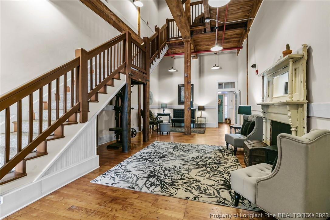 100 Carolyns Mill Place Rockingham, NC 28379 - Photo 29 of 30 a living room with fireplace furniture and a rug