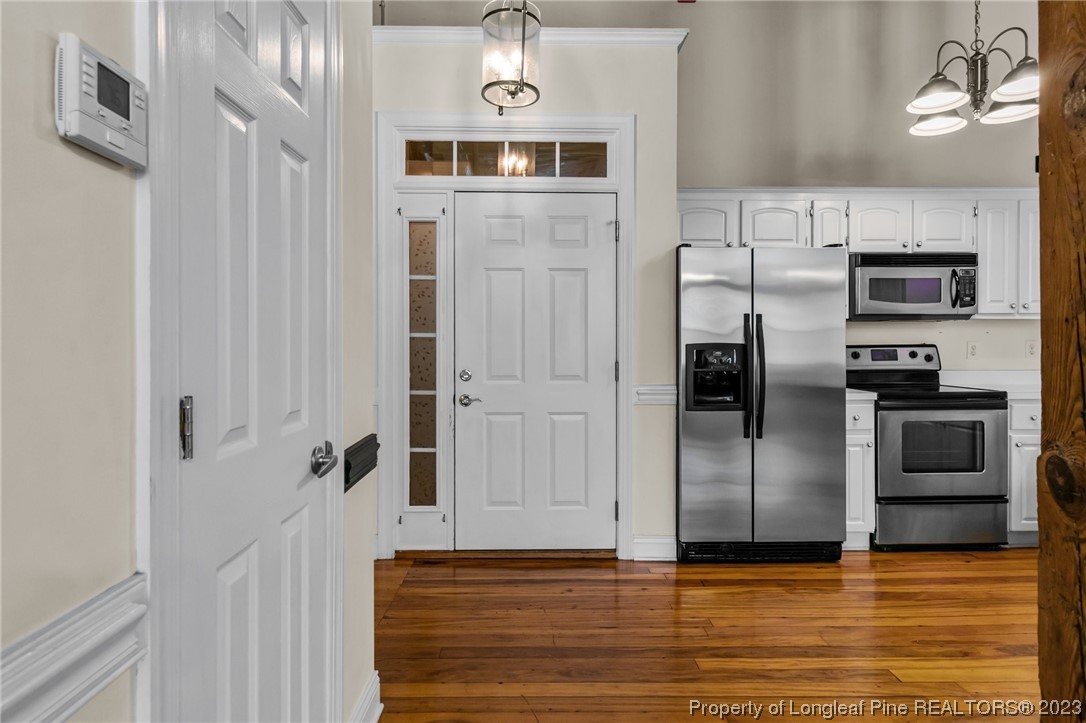 100 Carolyns Mill Place Rockingham, NC 28379 - Photo 8 of 30 a view of a kitchen with refrigerator and an oven
