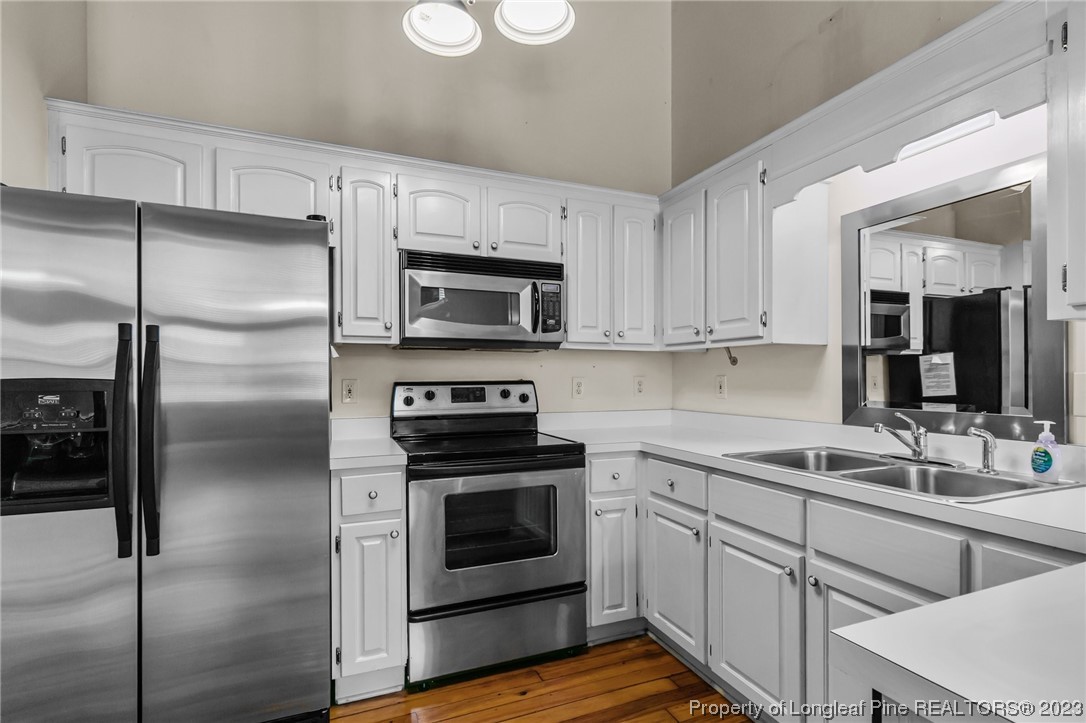 100 Carolyns Mill Place Rockingham, NC 28379 - Photo 10 of 30 a kitchen with cabinets stainless steel appliances and a counter space