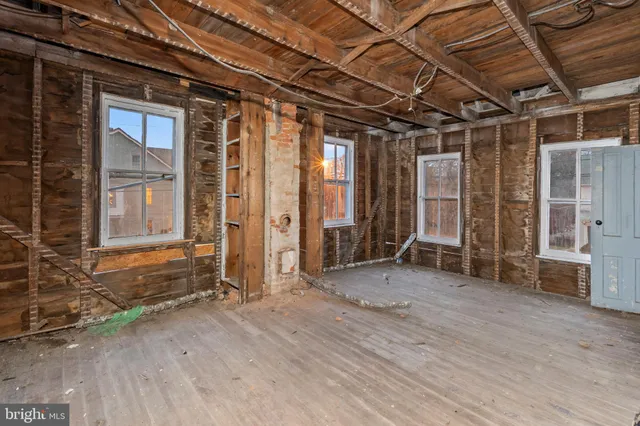 a view of a room with wooden walls