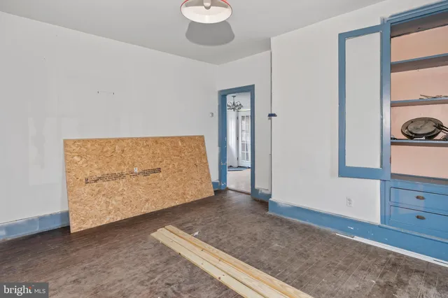 a view of room with window and hardwood floor