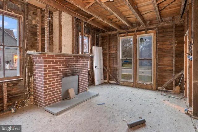 a view of an empty room with wooden walls