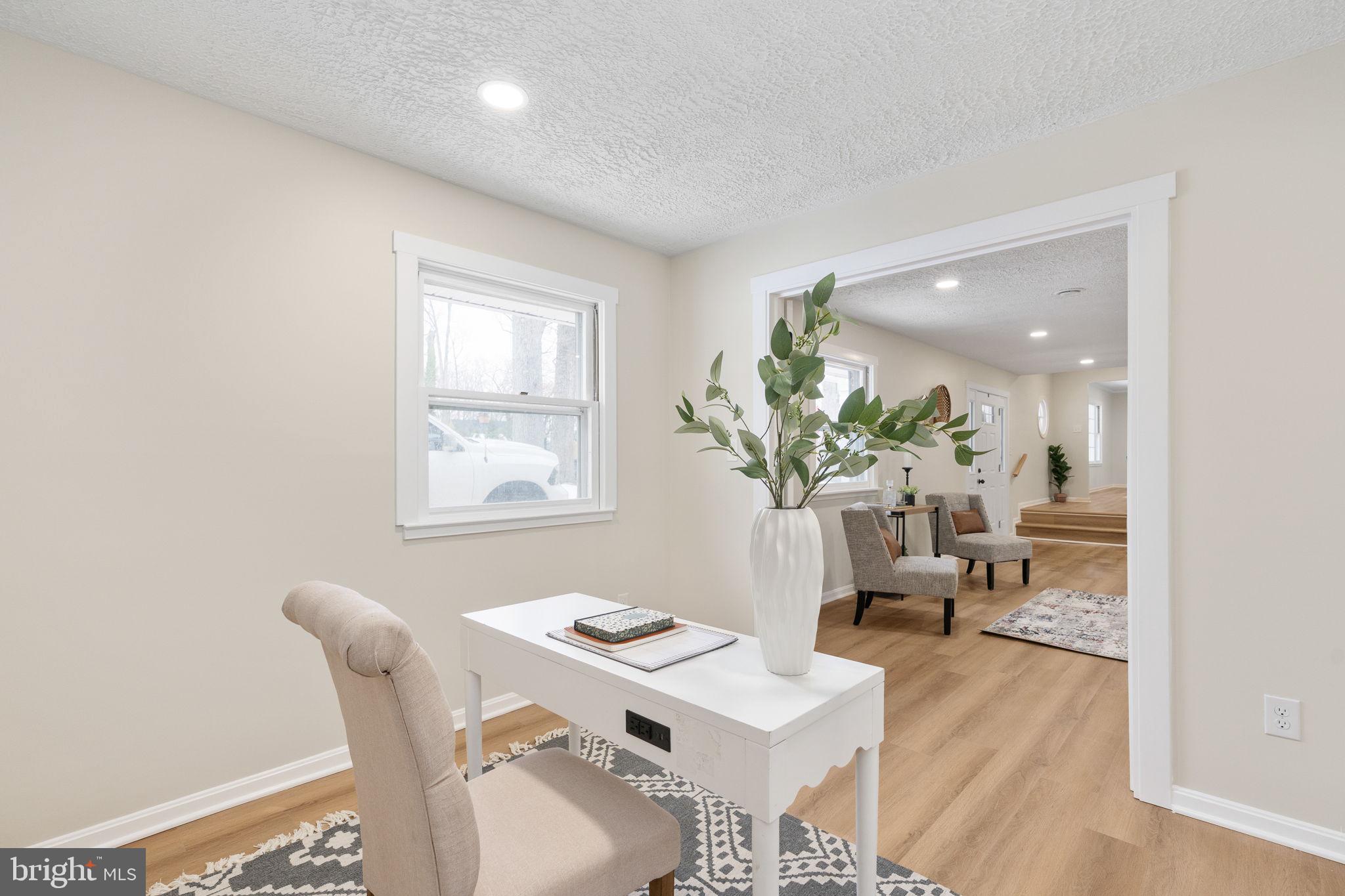 3234 Riverview Drive Triangle, VA 22172 - Photo 25 of 61 a view of a dining room with furniture and a potted plant