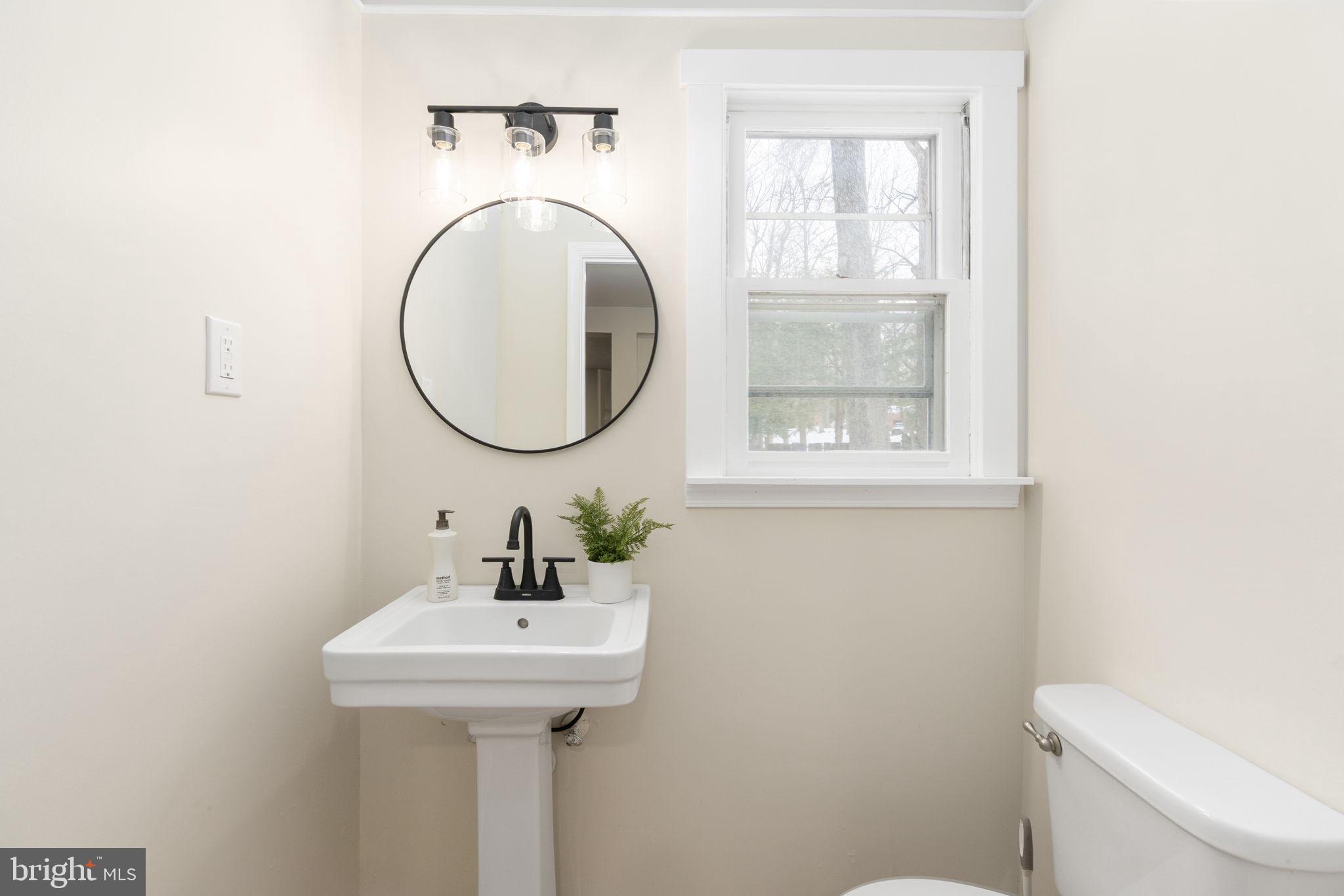 3234 Riverview Drive Triangle, VA 22172 - Photo 29 of 61 a bathroom with a sink a mirror and a toilet