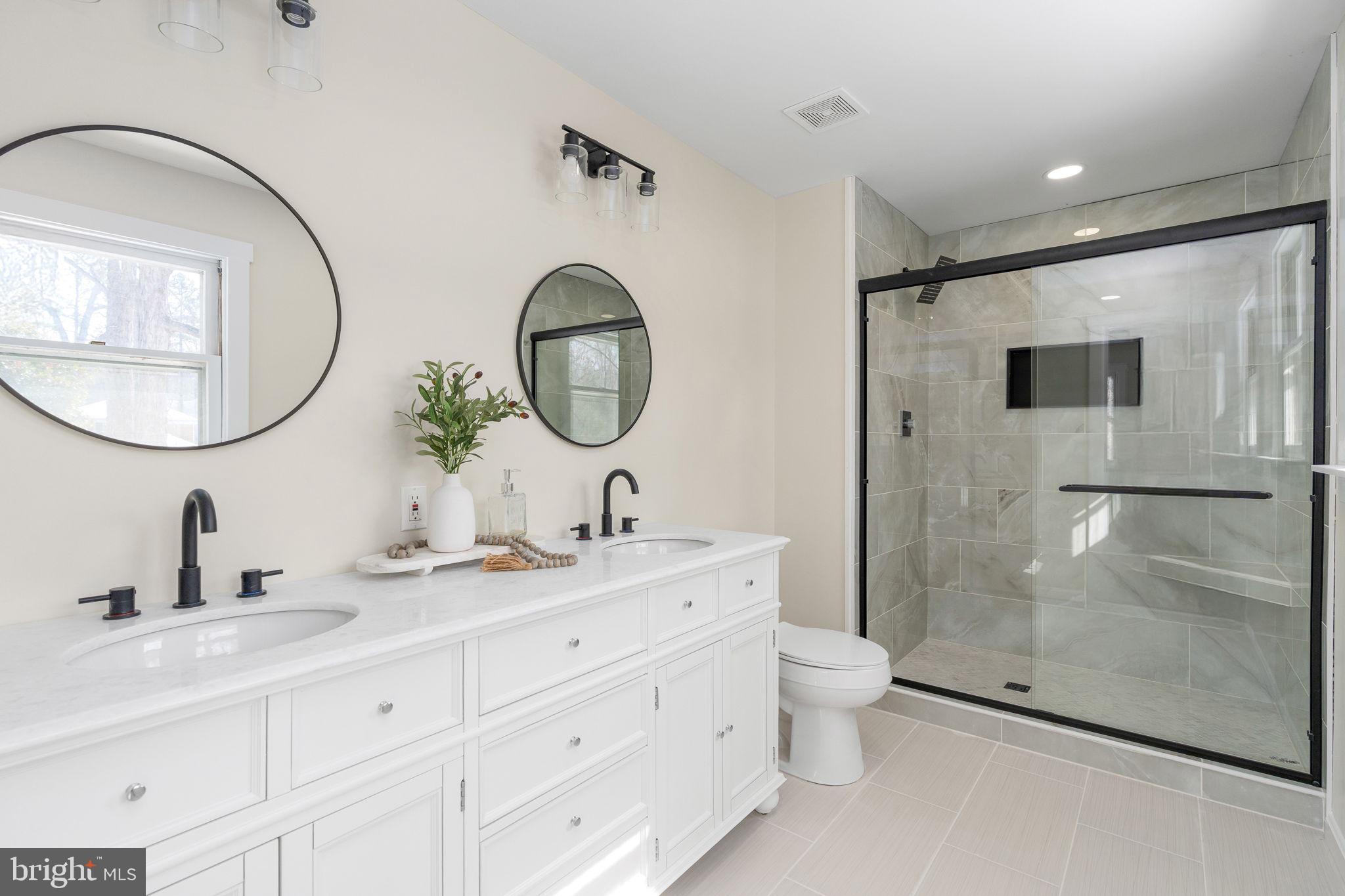 3234 Riverview Drive Triangle, VA 22172 - Photo 33 of 61 a bathroom with a double vanity sink mirror and toilet