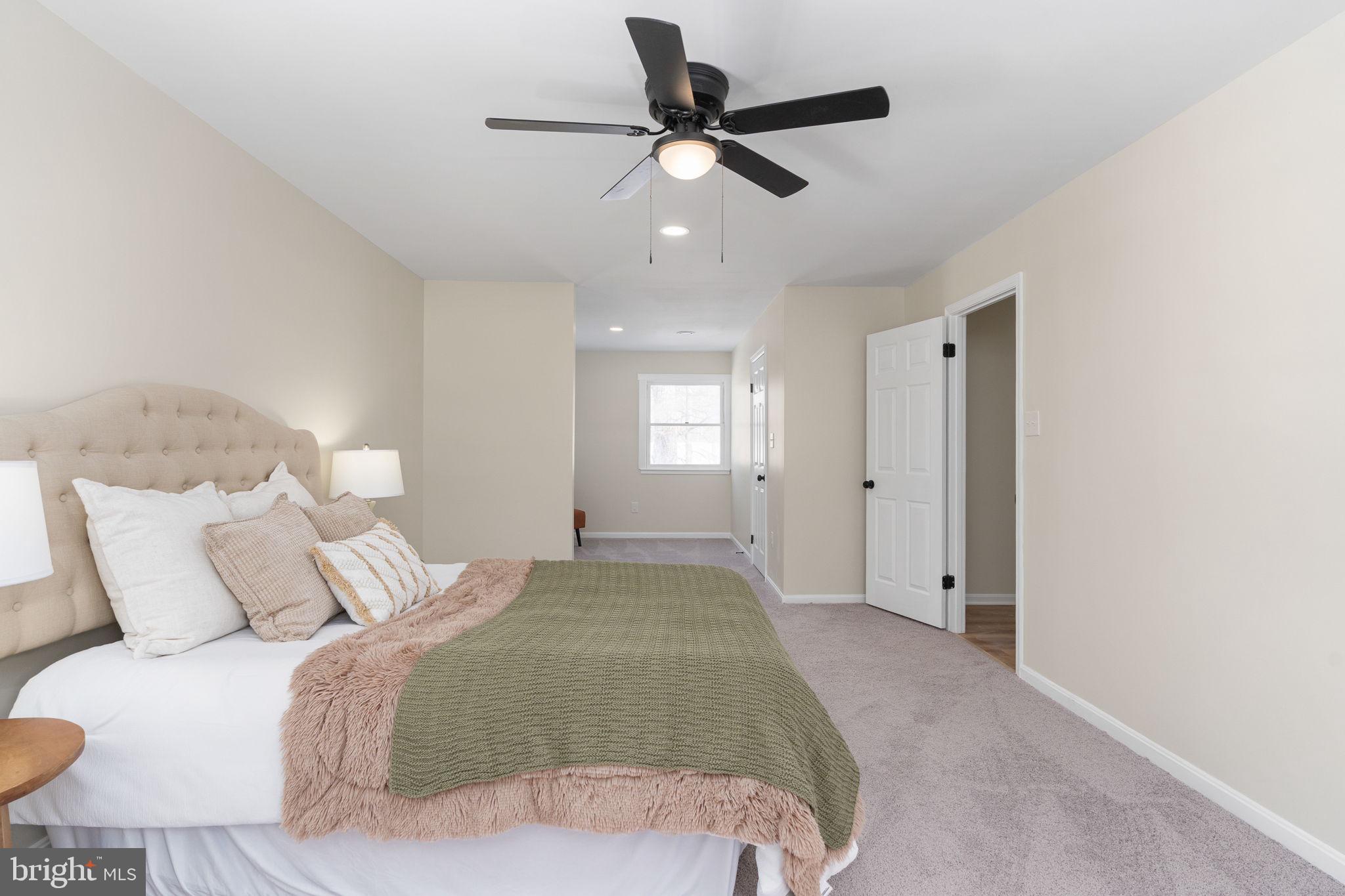 3234 Riverview Drive Triangle, VA 22172 - Photo 39 of 61 a bedroom with a bed and a ceiling fan
