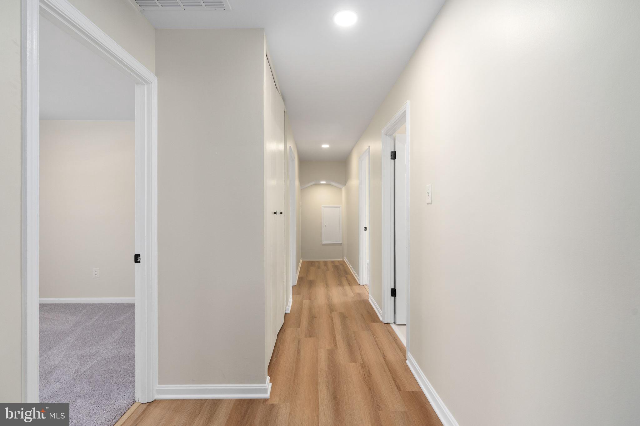 3234 Riverview Drive Triangle, VA 22172 - Photo 43 of 61 a view of a hallway with wooden floor and staircase