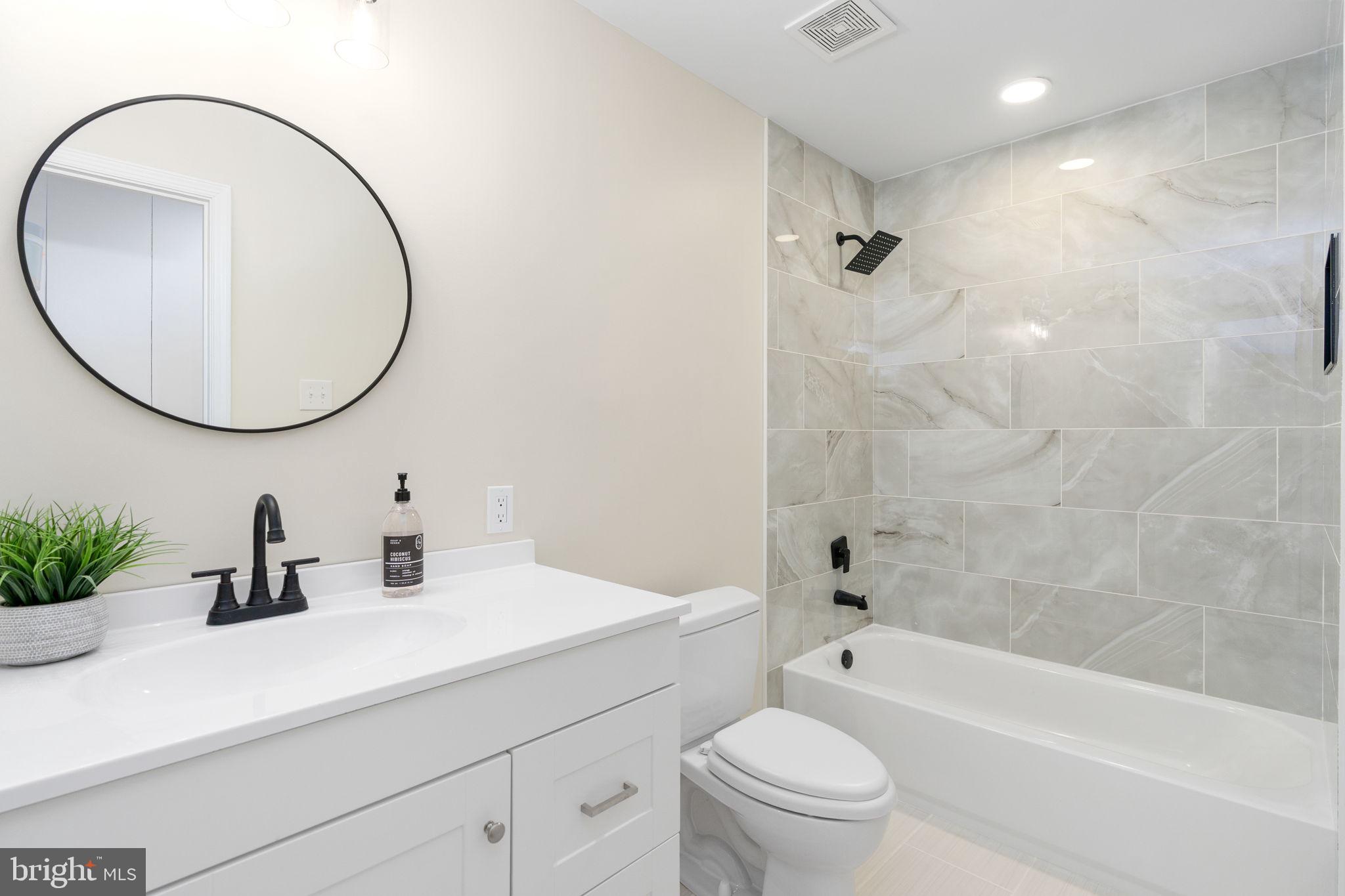 3234 Riverview Drive Triangle, VA 22172 - Photo 47 of 61 a bathroom with a sink a toilet and a mirror