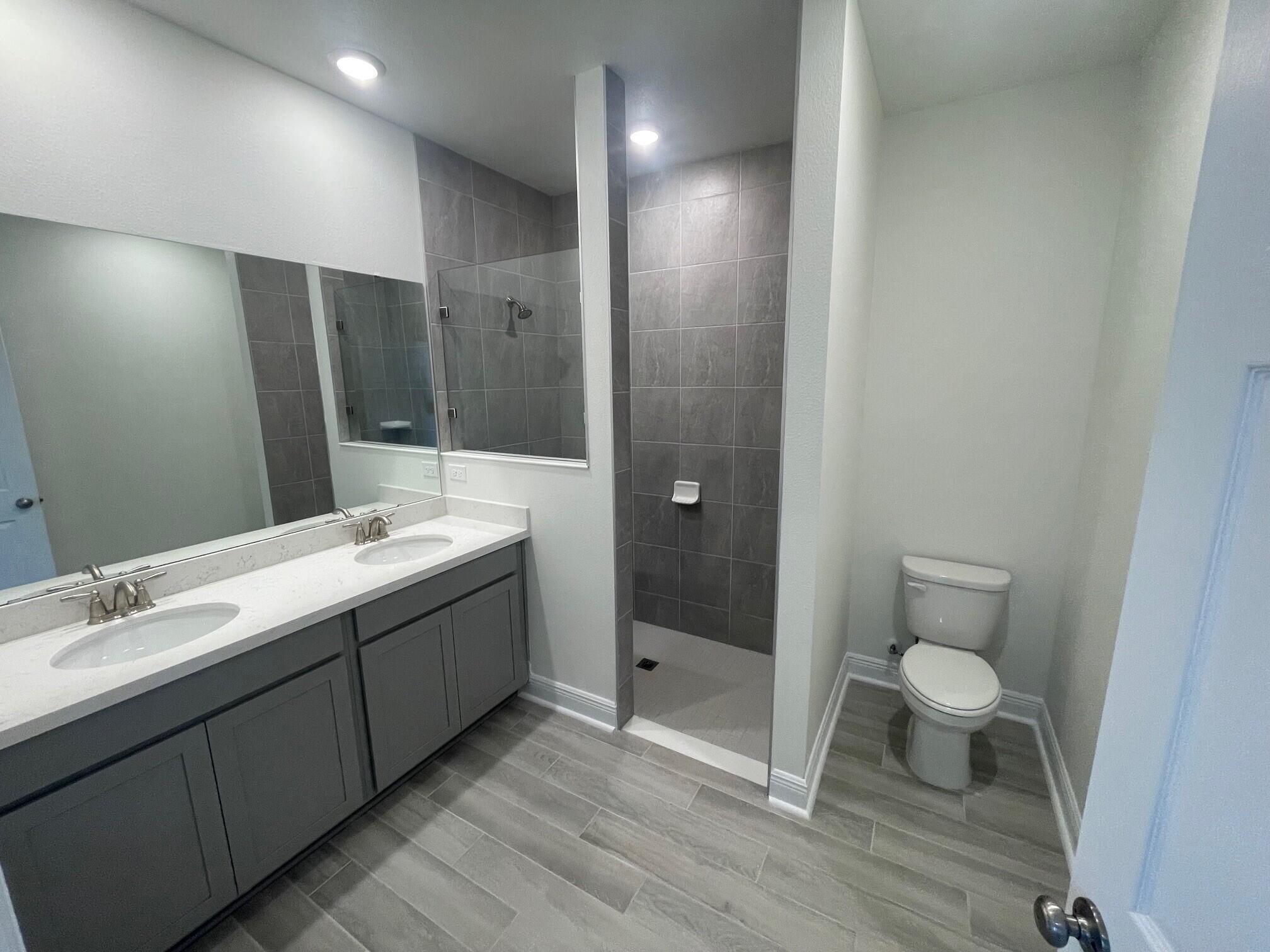 13 Splendor Run Ponce de Leon, FL 32455 - Photo 4 of 5 a bathroom with a double vanity sink toilet and shower