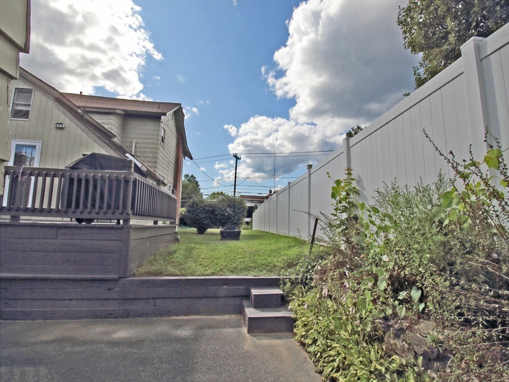 161 High Street Greenfield, MA 01301 - Photo 28 of 42 a view of a house with a yard