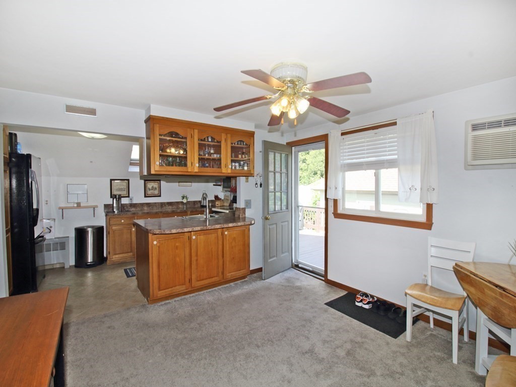 161 High Street Greenfield, MA 01301 - Photo 8 of 42 a view of a kitchen with furniture and a window