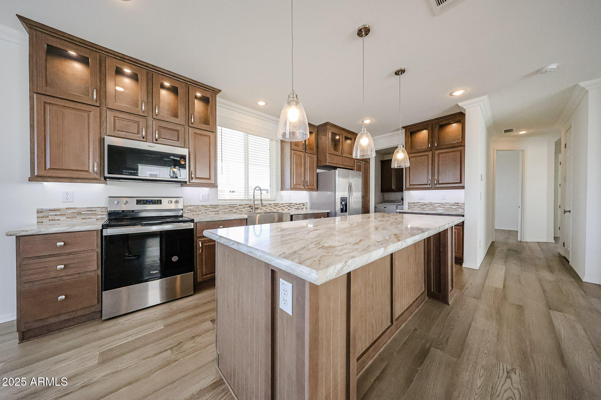 16101 North El Mirage Road, Unit 16 El Mirage, AZ 85335 - Photo 1 of 25 a kitchen with stainless steel appliances granite countertop a stove and a wooden floors