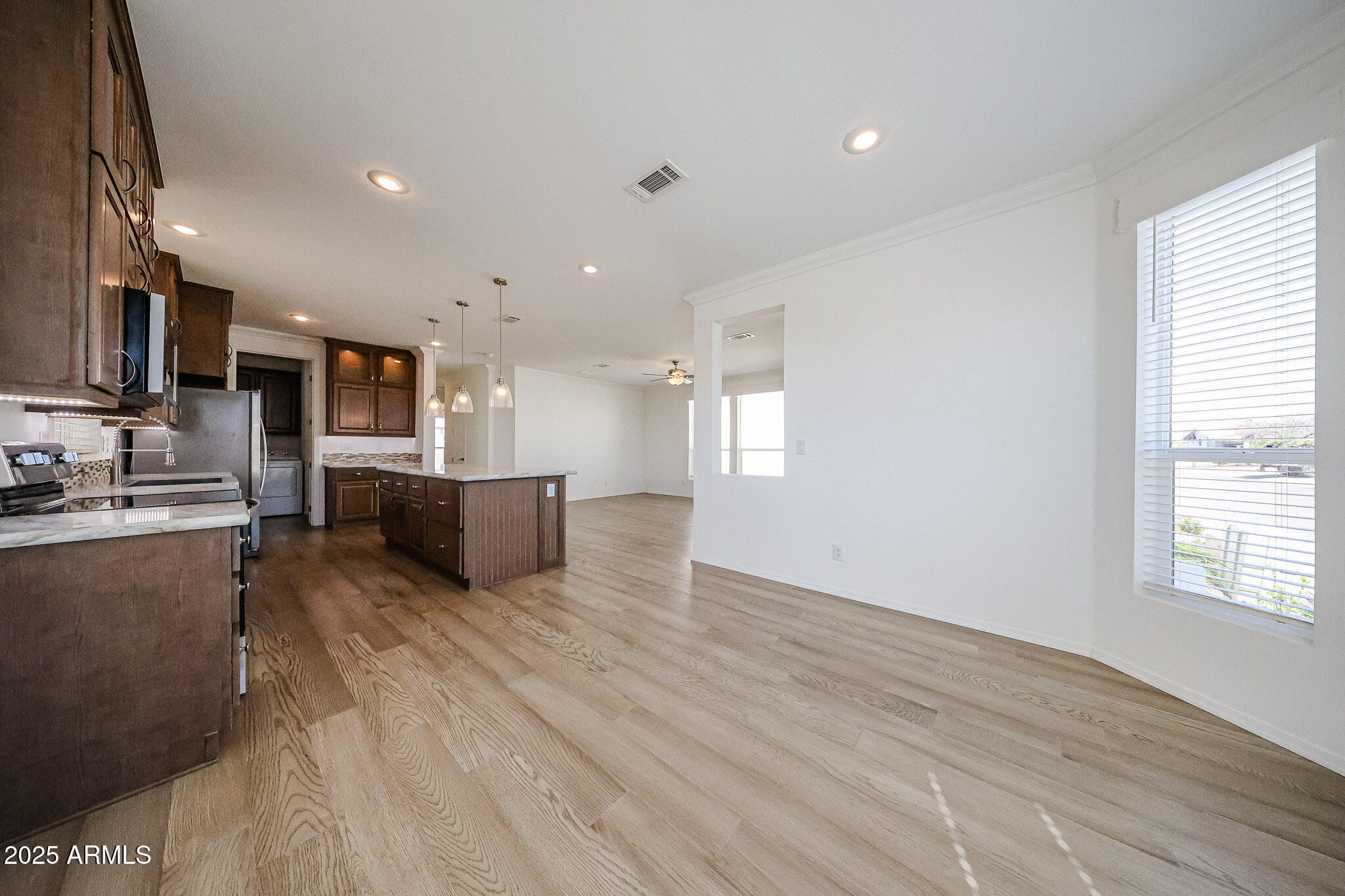 16101 North El Mirage Road, Unit 16 El Mirage, AZ 85335 - Photo 9 of 25 a view of kitchen with wooden floor and electronic appliances