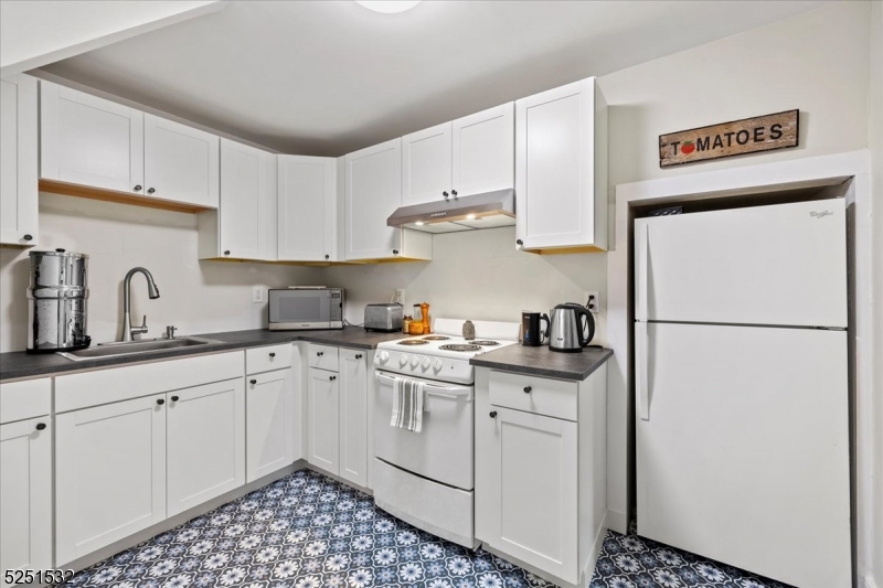 16 Schooleys Mountain Road, Unit 4 Long Valley, NJ 07853 - Photo 2 of 10 a kitchen with stainless steel appliances granite countertop a sink stove and refrigerator