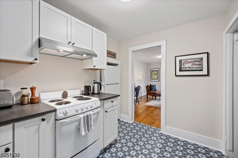 16 Schooleys Mountain Road, Unit 4 Long Valley, NJ 07853 - Photo 3 of 10 a kitchen with stainless steel appliances granite countertop a sink stove and cabinets