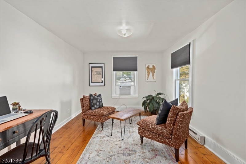 16 Schooleys Mountain Road, Unit 4 Long Valley, NJ 07853 - Photo 4 of 10 a living room with furniture and wooden floor