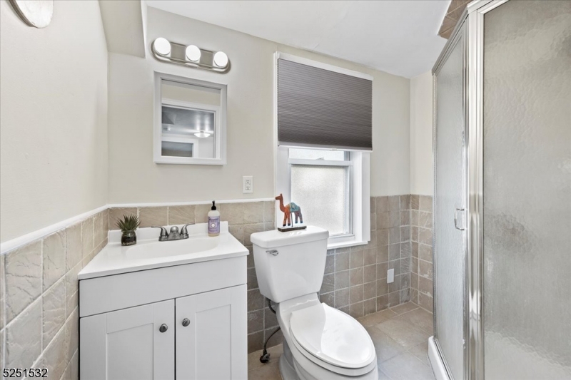 16 Schooleys Mountain Road, Unit 4 Long Valley, NJ 07853 - Photo 8 of 10 a bathroom with a sink mirror toilet and shower