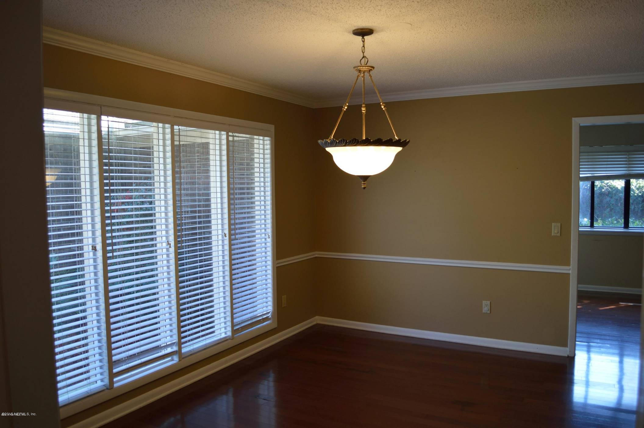 11468 Scott Mill Road Jacksonville, FL 32223 - Photo 5 of 25 a view of a room with window and wooden floor