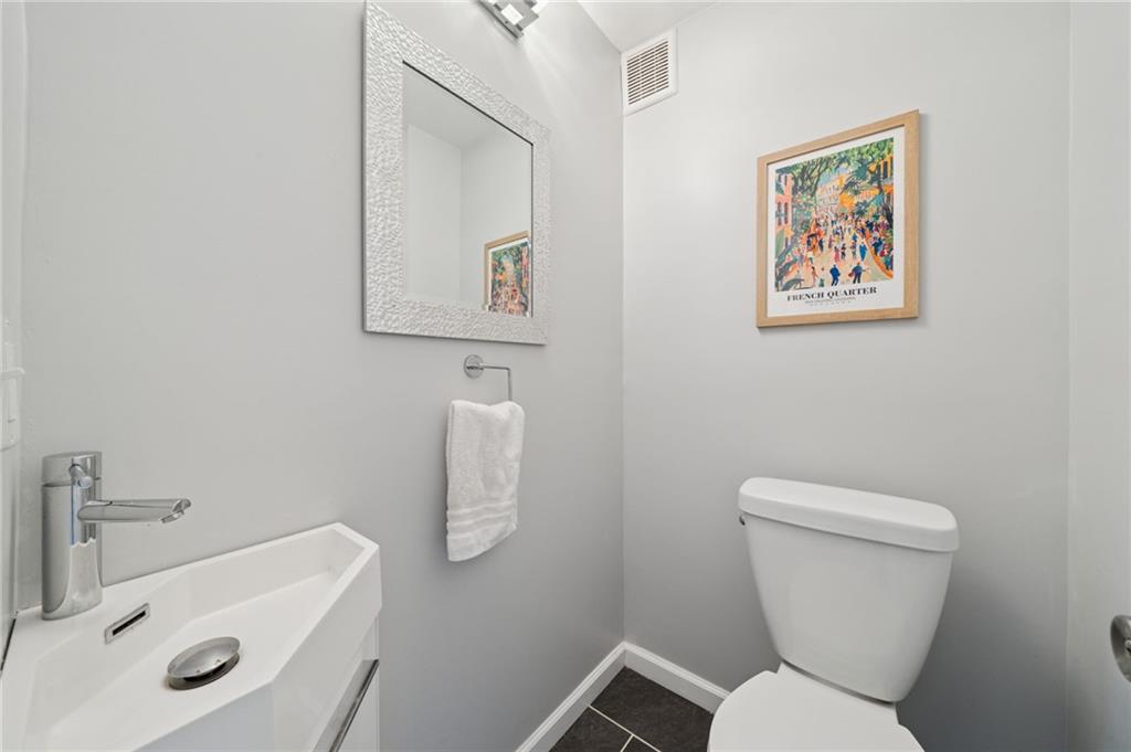 2415 Collins Road Pittsburgh, PA 15235 - Photo 16 of 31 a white toilet sitting next to a bathroom sink
