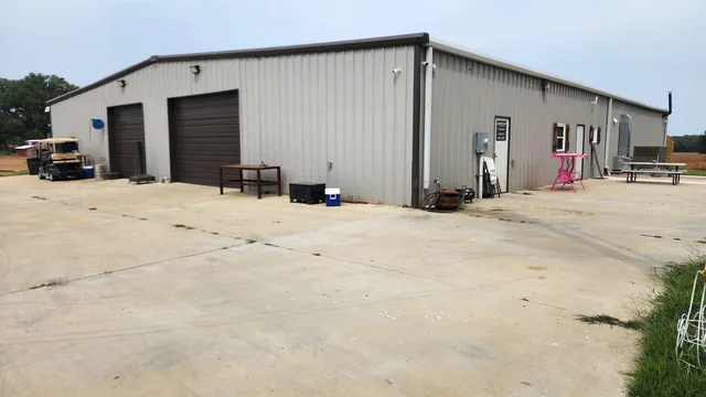 a view of garage with large windows