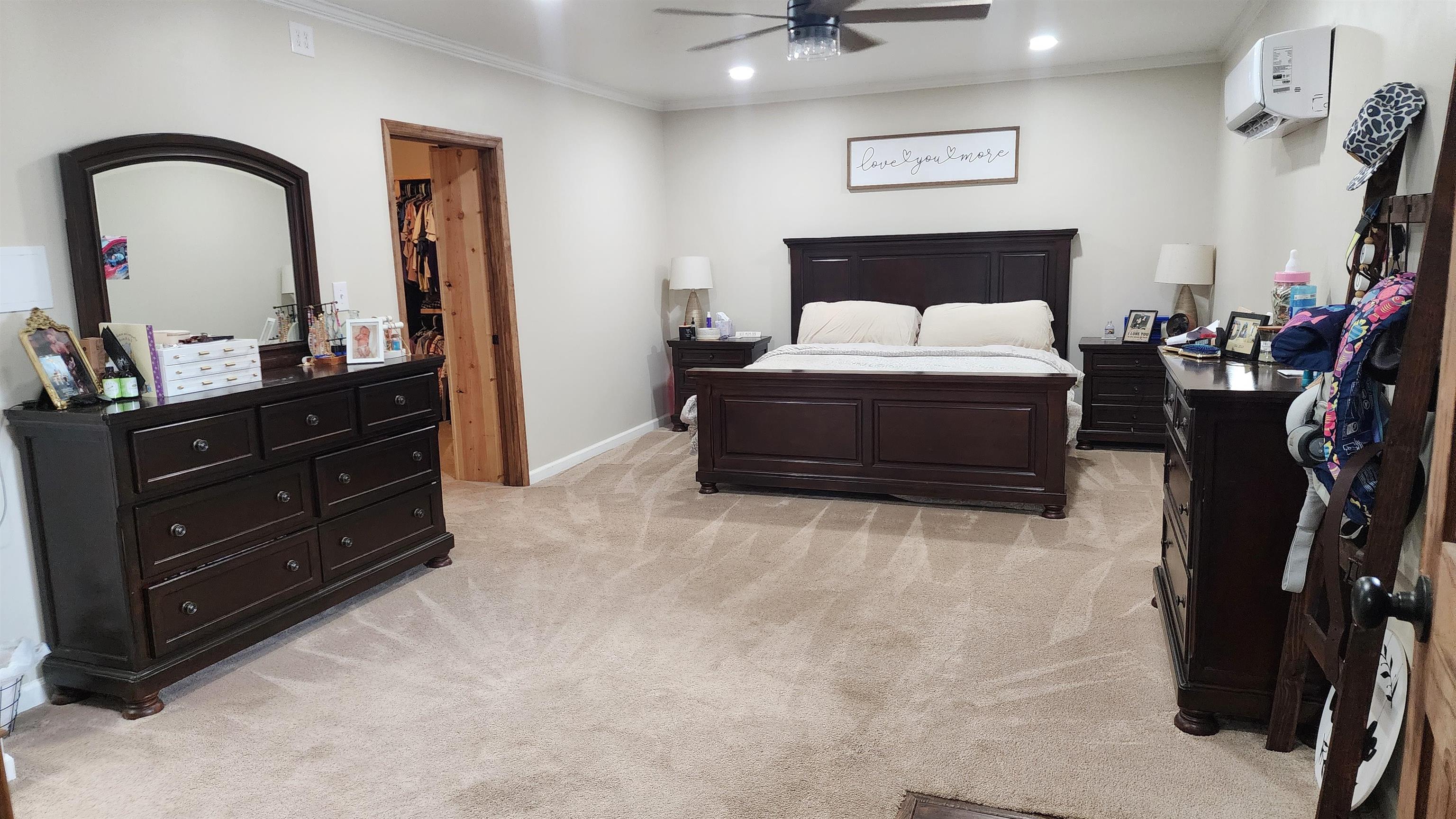 948 George Weakley Road Dyersburg, TN 38024 - Photo 5 of 31 a bedroom with a bed and a dresser