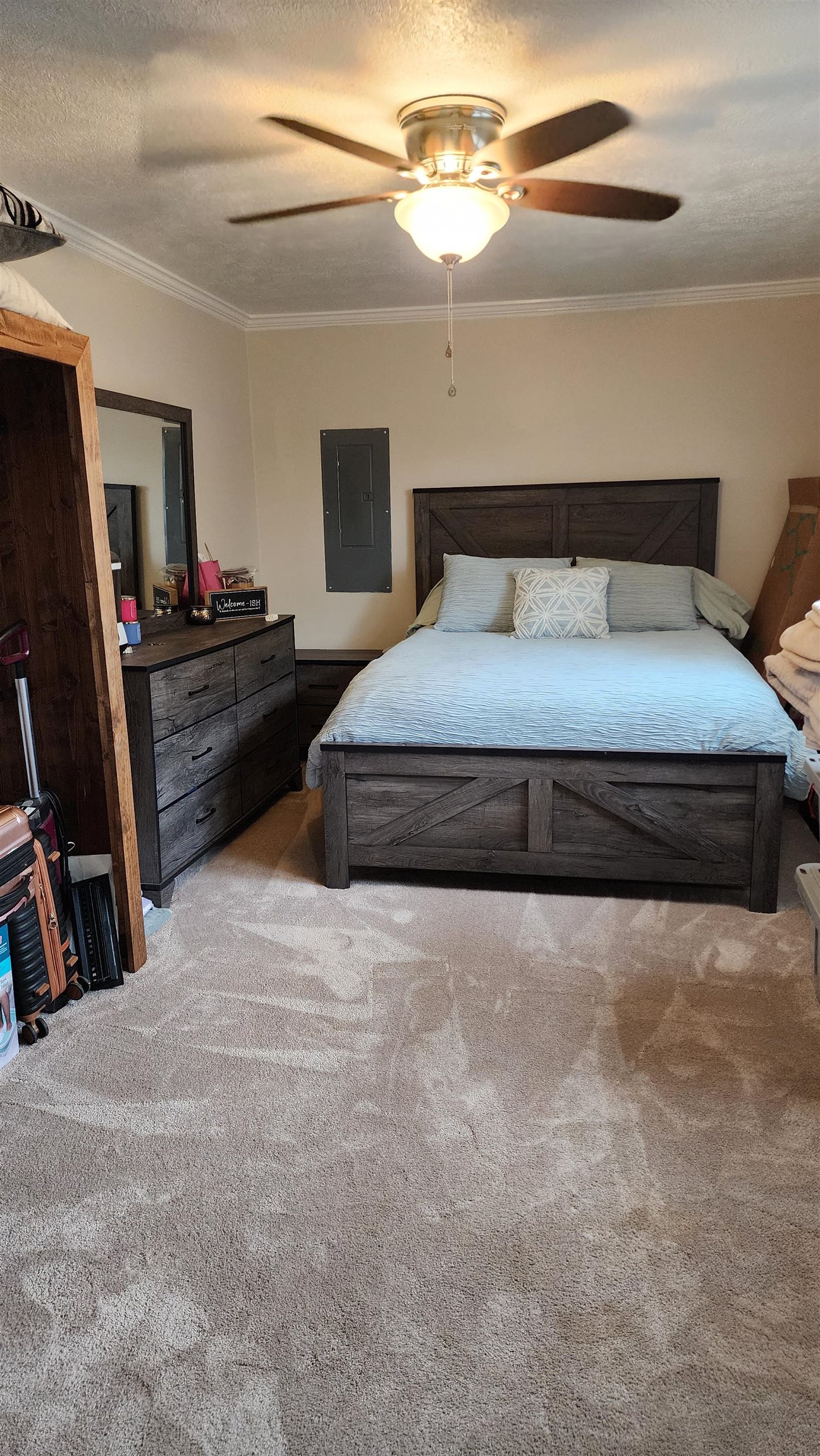 948 George Weakley Road Dyersburg, TN 38024 - Photo 10 of 31 a bedroom with a bed and a flat tv screen on a dresser