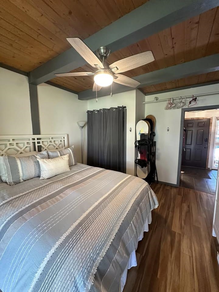 3252 Chateau Road, Unit 43 Mammoth Lakes, CA 93546 - Photo 14 of 29 Wood-finish flooring, exposed wood beam ceiling, and a ceiling fan with integrated lighting
