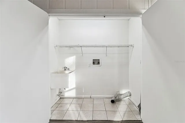 a kitchen with stainless steel appliances granite countertop a sink a refrigerator and window