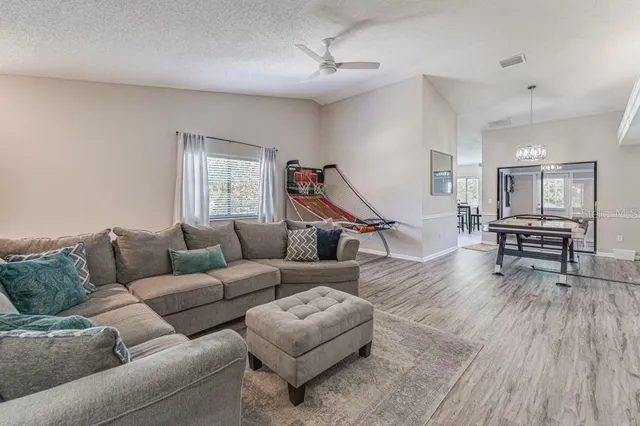 an aerial view of a house with a yard
