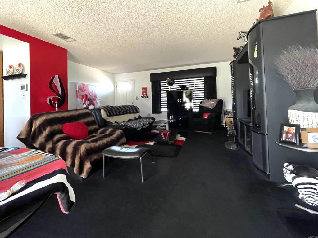 1902 Tierra Del Sol Road Boulevard, CA 91905 - Photo 14 of 37 a living room with furniture and a couch