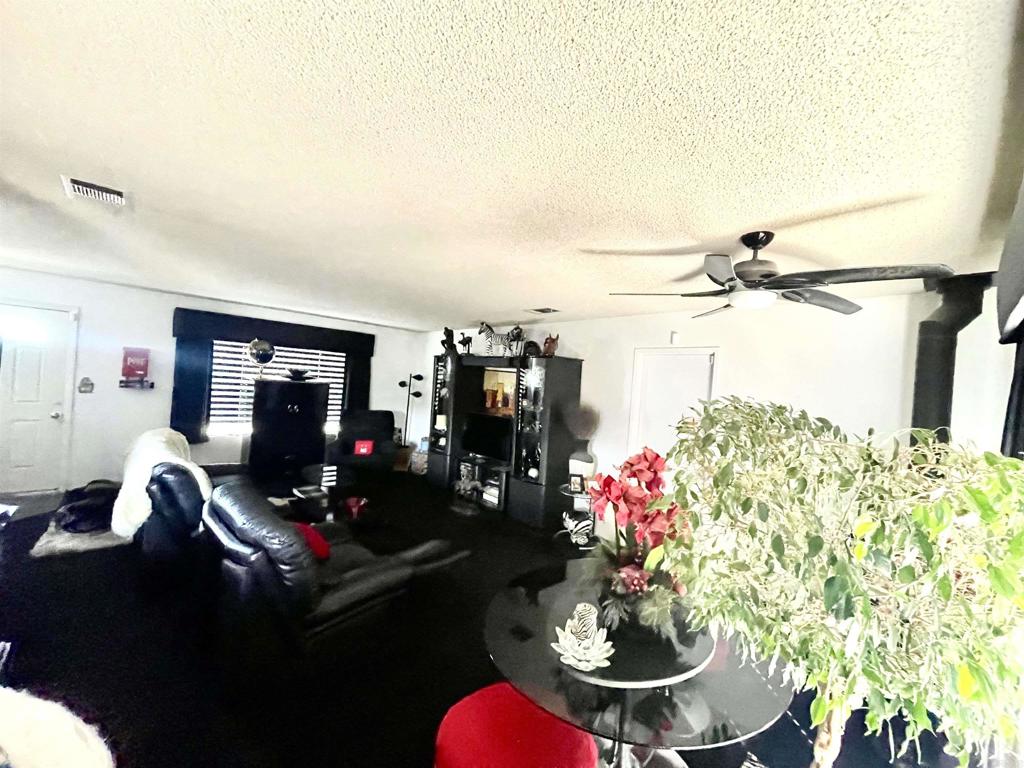 1902 Tierra Del Sol Road Boulevard, CA 91905 - Photo 17 of 37 a living room with furniture and flowers