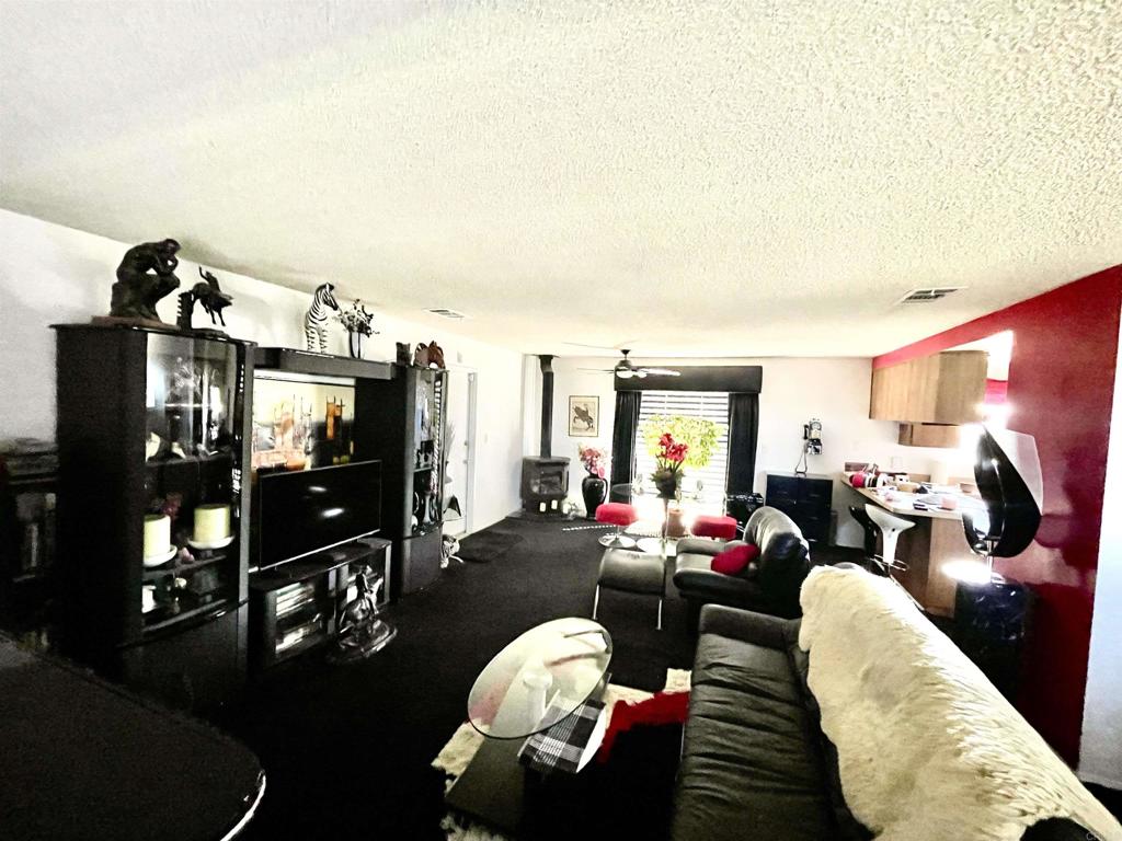 1902 Tierra Del Sol Road Boulevard, CA 91905 - Photo 18 of 37 a living room with furniture a rug and a flat screen tv