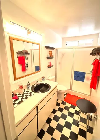 a bedroom with a bed and a cabinets