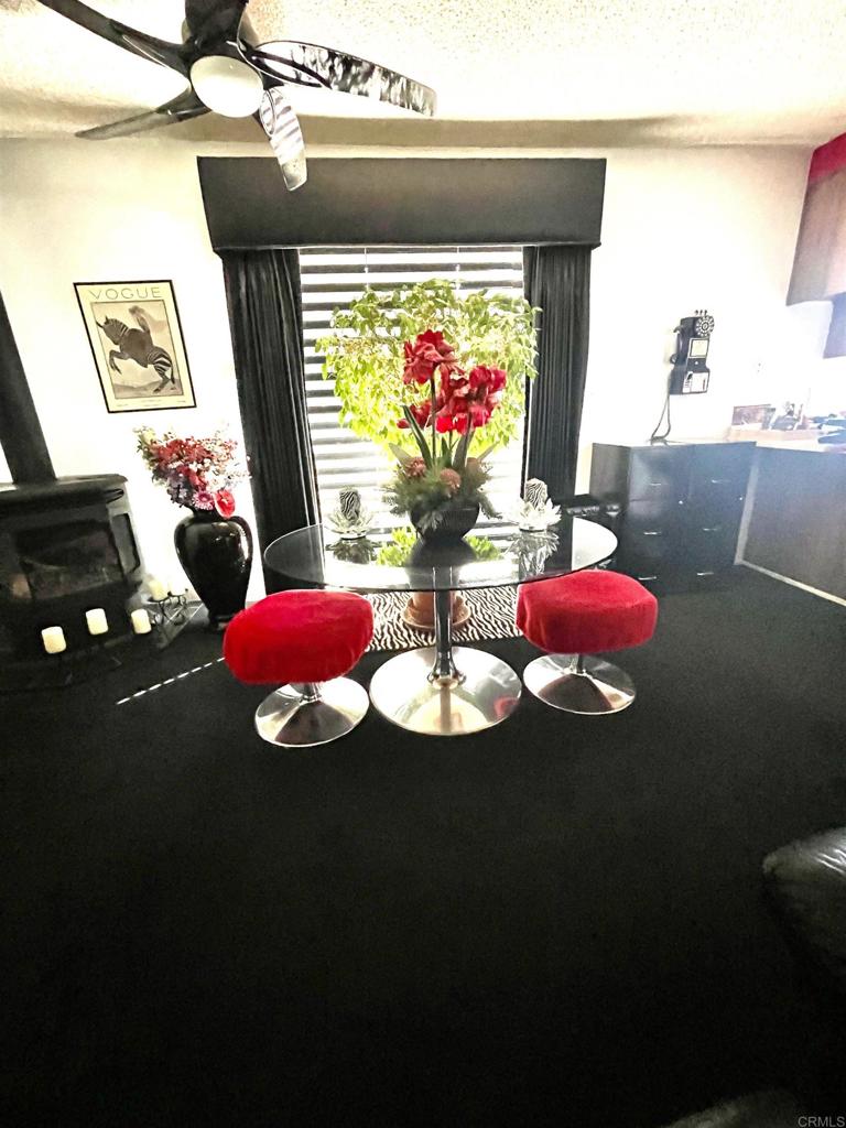 1902 Tierra Del Sol Road Boulevard, CA 91905 - Photo 19 of 37 a table with chairs and a fireplace