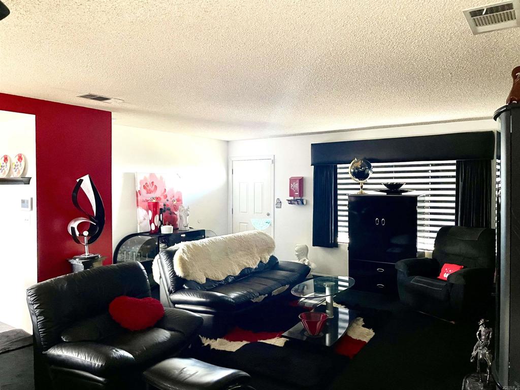 1902 Tierra Del Sol Road Boulevard, CA 91905 - Photo 21 of 37 a bedroom with furniture and a fireplace