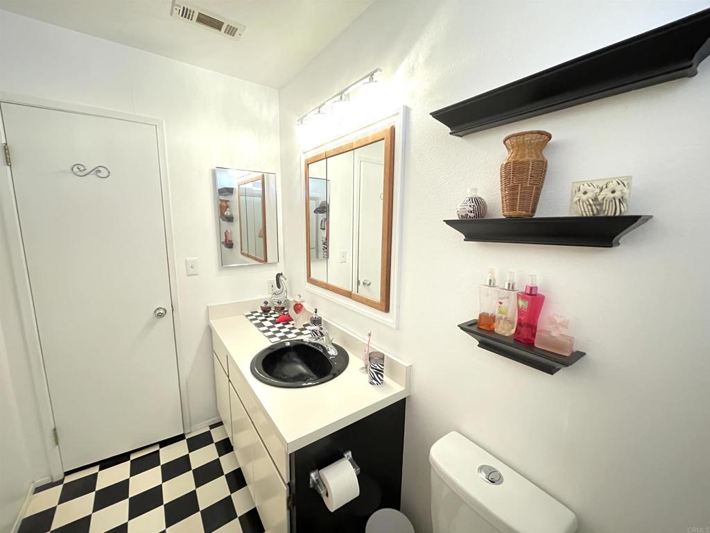 1902 Tierra Del Sol Road Boulevard, CA 91905 - Photo 29 of 37 a bathroom with a sink vanity mirror and vanity