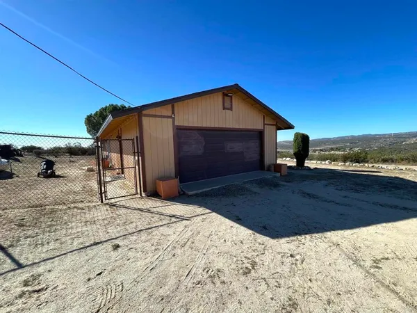 a view of a backyard of the house