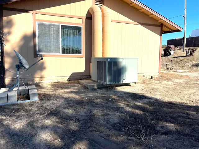 a view of a backyard of the house