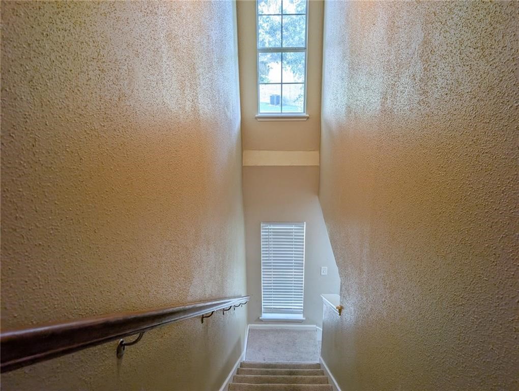 6702 Everhart Road, Unit S104 Corpus Christi, TX 78413 - Photo 11 of 22 a view of a room with wooden floor and a window