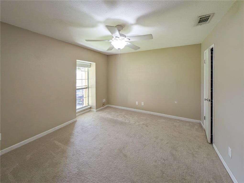 6702 Everhart Road, Unit S104 Corpus Christi, TX 78413 - Photo 12 of 22 a view of an empty room with a window