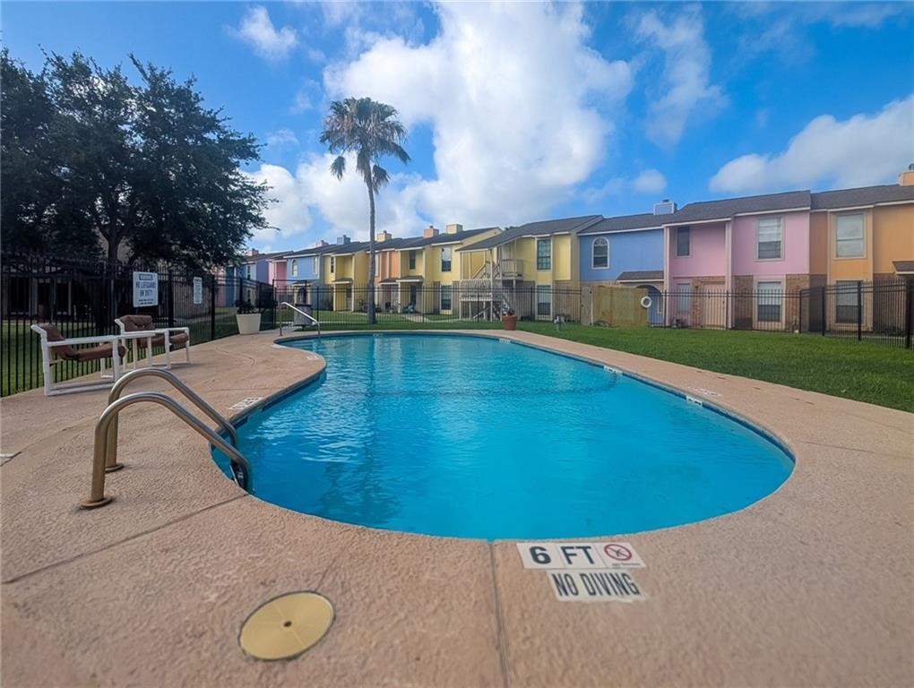 6702 Everhart Road, Unit S104 Corpus Christi, TX 78413 - Photo 18 of 22 a view of a swimming pool with a patio