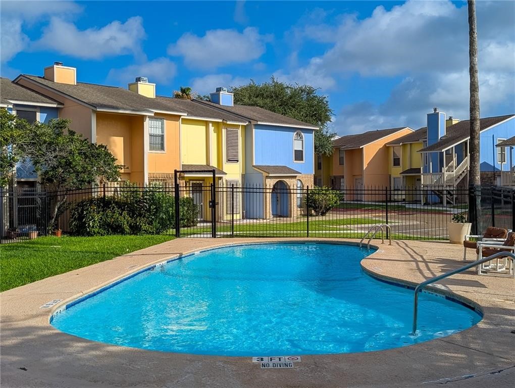 6702 Everhart Road, Unit S104 Corpus Christi, TX 78413 - Photo 19 of 22 a view of a house with swimming pool