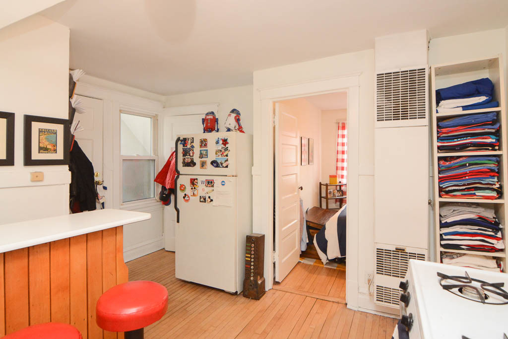1721 West Nelson Street, Unit CH3 Chicago, IL 60657 - Photo 6 of 20 a view of a kitchen with fridge and workspace