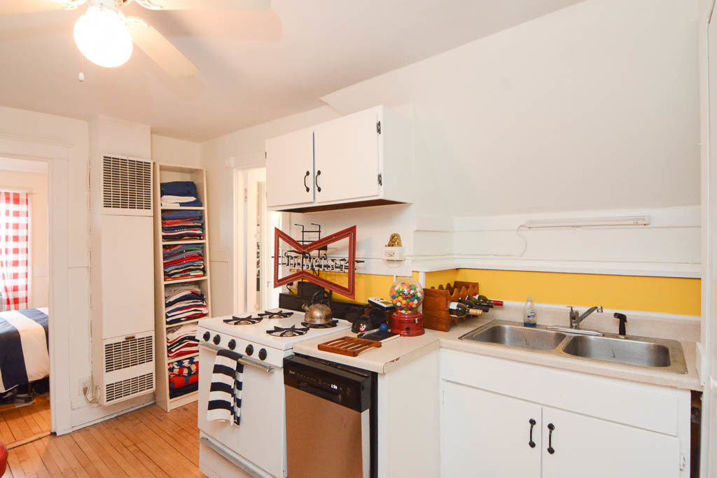 1721 West Nelson Street, Unit CH3 Chicago, IL 60657 - Photo 8 of 20 a kitchen with a stove and a white refrigerator
