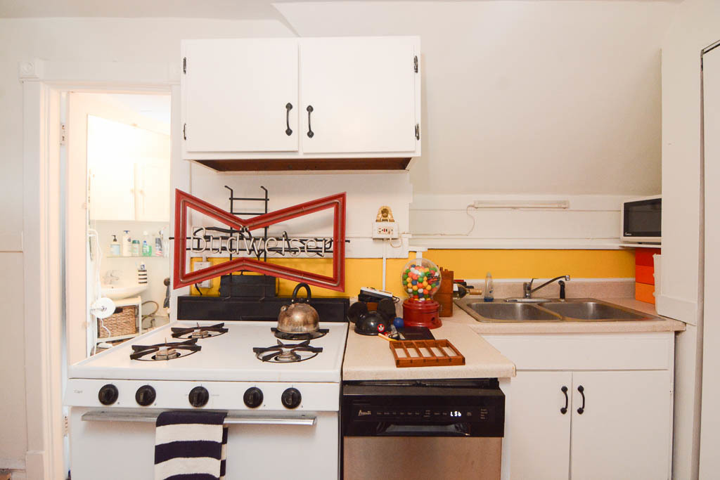 1721 West Nelson Street, Unit CH3 Chicago, IL 60657 - Photo 9 of 20 a kitchen with a sink a stove and a refrigerator