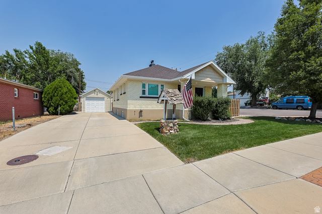 59 East 8680th Street South Sandy, UT 84070 - Photo 24 of 33 Single-story residence featuring light-toned brick facade and a covered front porch