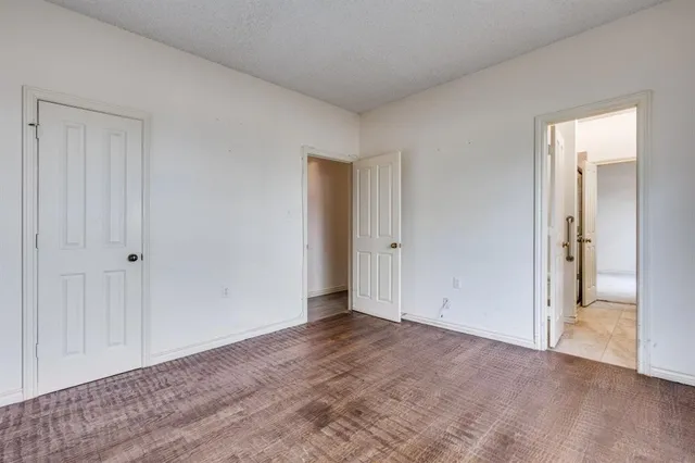 a view of an empty room and closet area