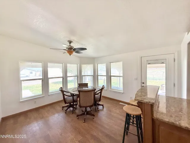 a view of a dining room with furniture window and outside view