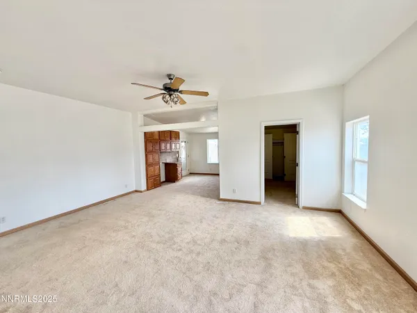 a view of a big room with windows and cabinet